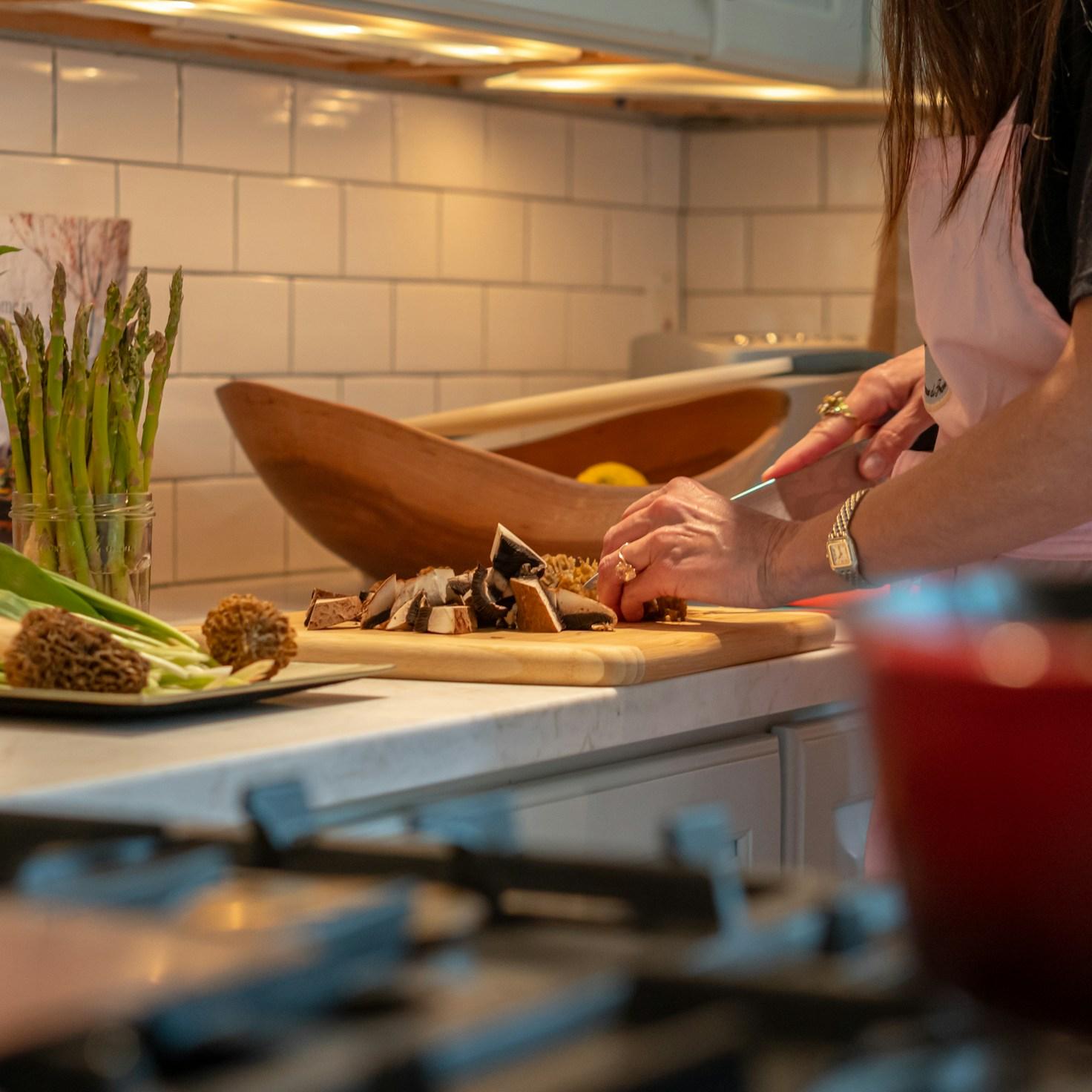 Community members collaborating in a modern kitchen space, sharing recipes and cooking techniques